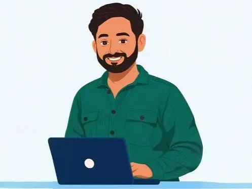 MUSA A man with a beard wearing a green shirt is seated at a desk, focused on his laptop. Digital Marketing Freelancer in Kunnamkulam.